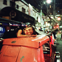 Girl on Top of a Tricycle