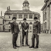 Three gentelmen in bowler hats