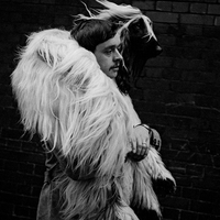 'Man Carrying Afghan'