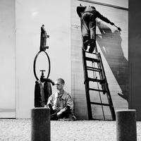 Man in front of billboards