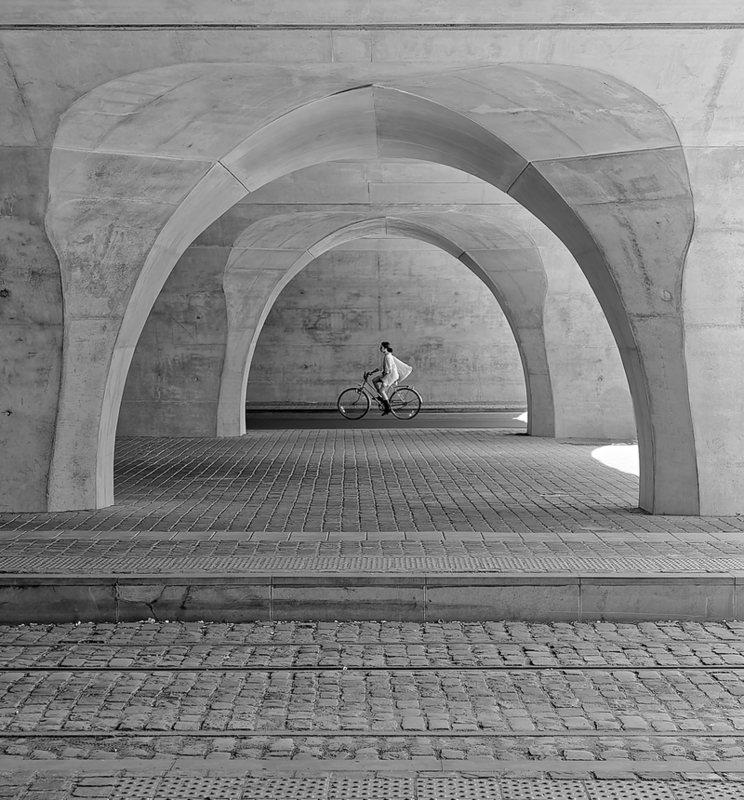 cyclists under the arches