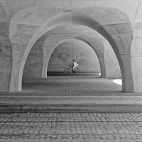 cyclists under the arches