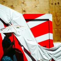 Woman With Umbrella Walking By A Metropolitan Canvas