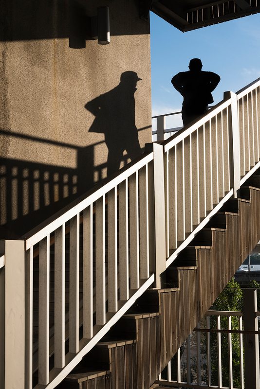 Man's shadow and handrail