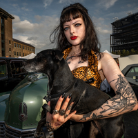Young Lady and dog at the Classic Car Boot Sale, London 2023