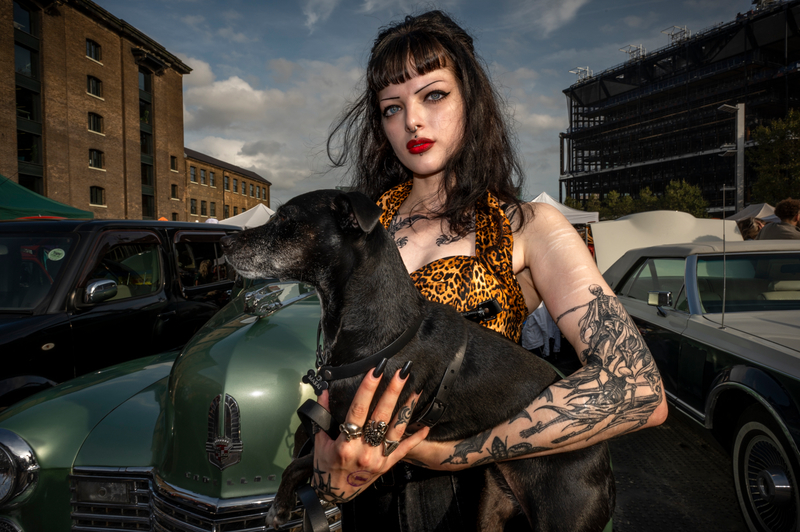Young Lady and dog at the Classic Car Boot Sale, London 2023