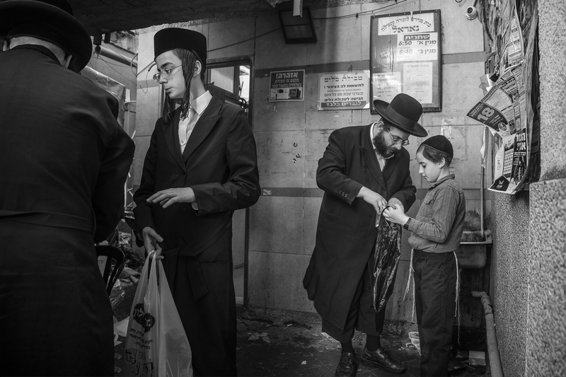 Father and son observe the Passover tradition