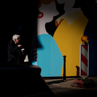 moments in front of the colorful billboard