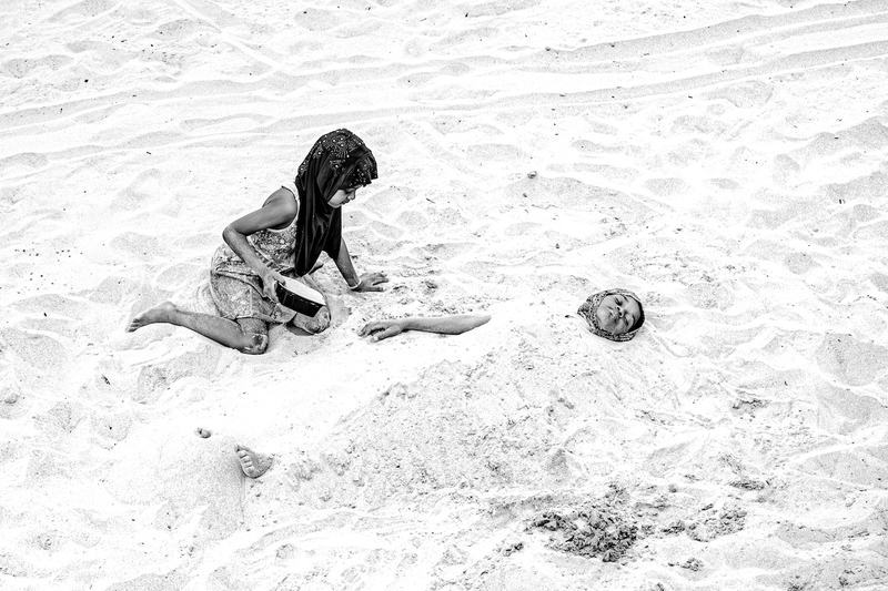 Girl and Mom Playing on Beach